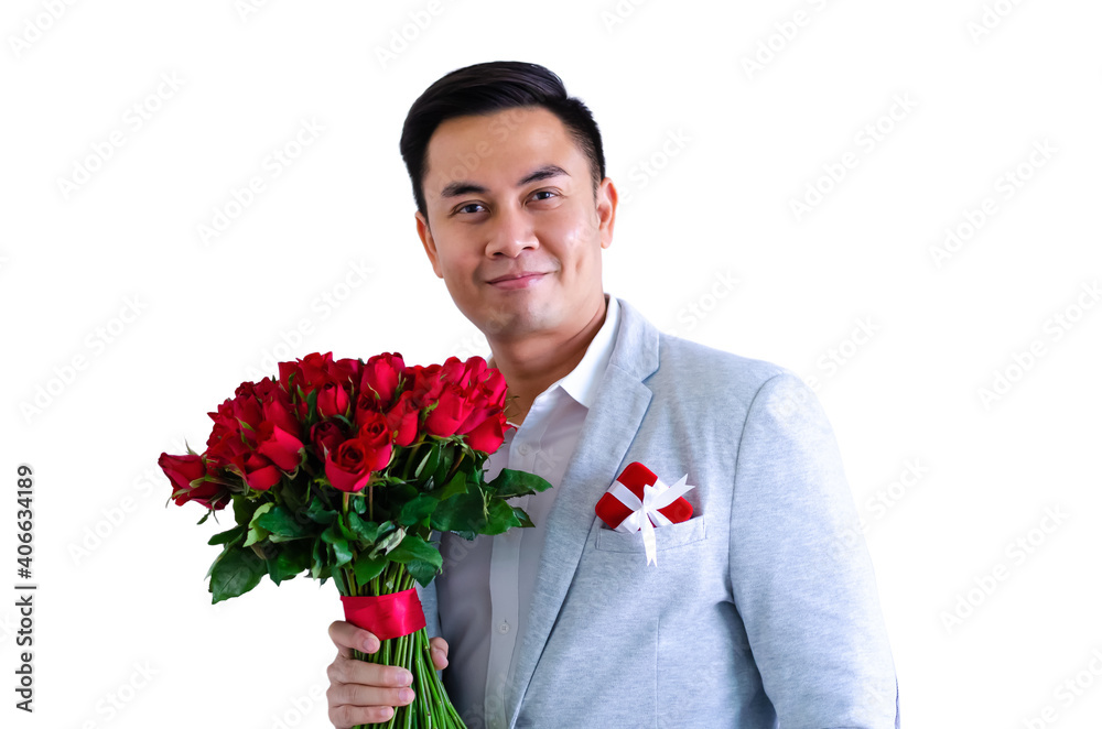 Asian man wearing grey suit holding a bouquet of red roses and red gift box isolated in white background for anniversary or Valentine's day concept. Asian man wearing grey suit holding a bouquet of red roses and red gift box isolated in white background for anniversary or Valentine's day concept.