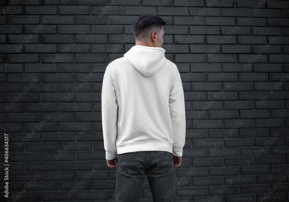 Long sleeve white mens clothing template on young guy on brick wall  background, back view, blank hoodie with hood. Stock Photo | Adobe Stock