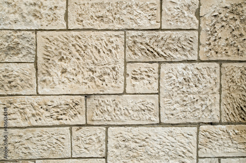 Old white stone wall closeup