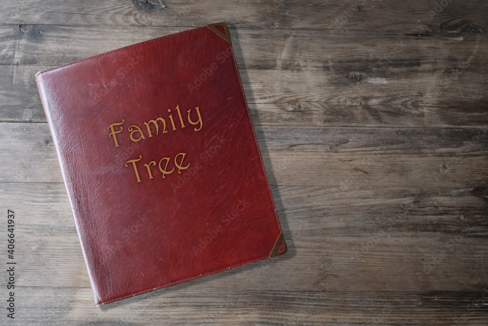 brown leather board on wooden background, scrapbook family tree in Leather, concept family genealogy, memories, generational ties, museum historical materials brown leather board on wooden background, scrapbook family tree in Leather, concept family genealogy, memories, generational ties, museum historical materials