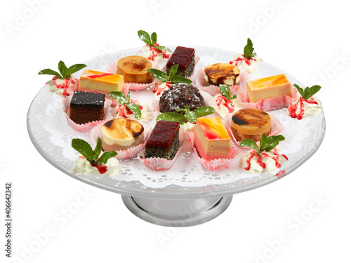 Assortment of pieces of cake on glass plate