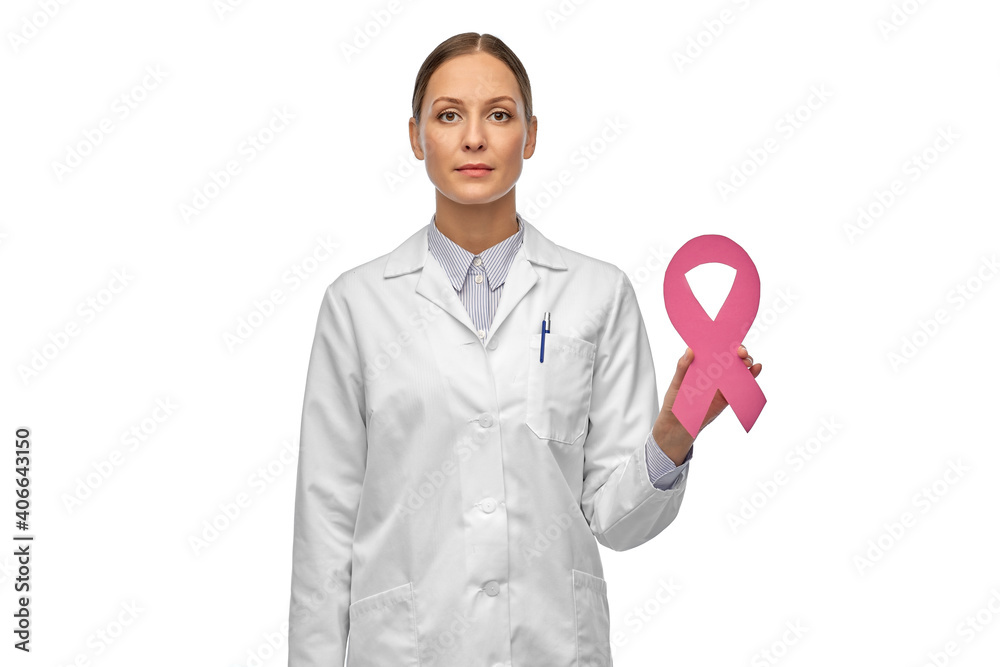 medicine, healthcare and oncology concept - female doctor in white coat with pink breast cancer awareness ribbon medicine, healthcare and oncology concept - female doctor in white coat with pink breast cancer awareness ribbon