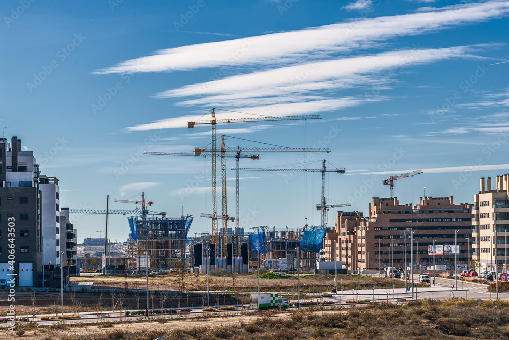 New neighborhood with buildings under construction with cranes. New neighborhood with buildings under construction with cranes.