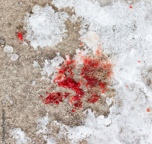blood stains on white snow as background