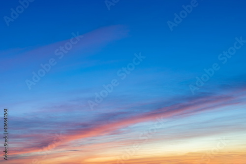 Heaven at early morning with copy space. Sunset, sunrise backdrop.Predawn clear sky with orange horizon and blue atmosphere. Smooth orange blue gradient of dawn sky.