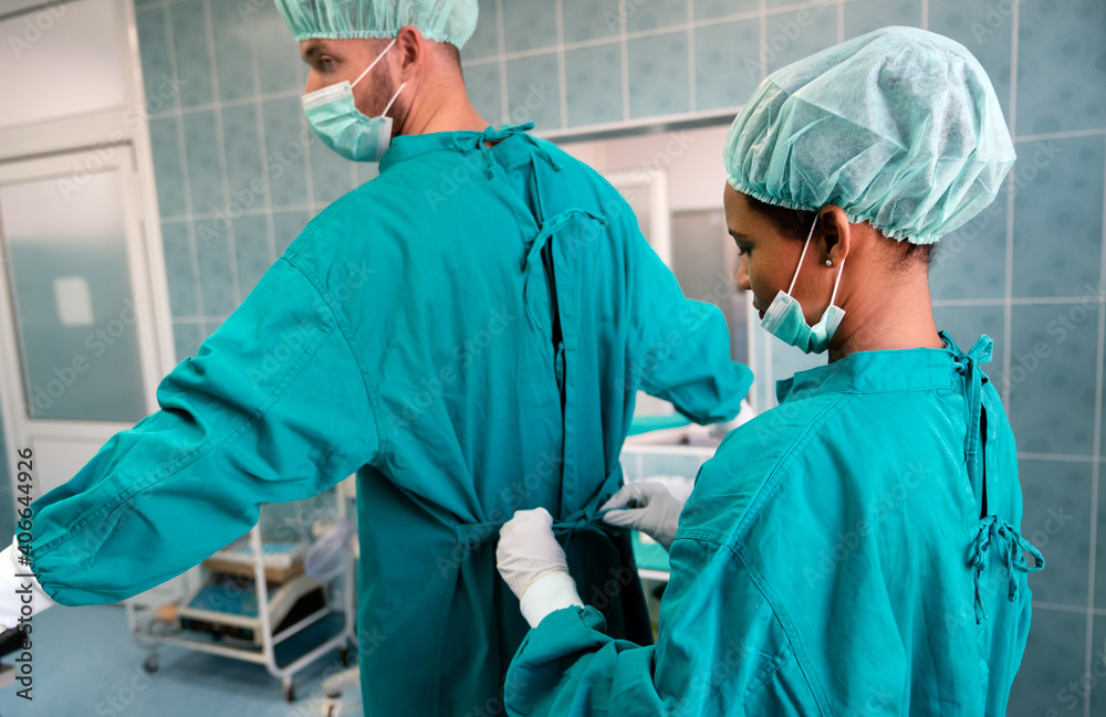 Exhausted surgeons at the emergency room as a sign of stress and overwork Exhausted surgeons at the emergency room as a sign of stress and overwork