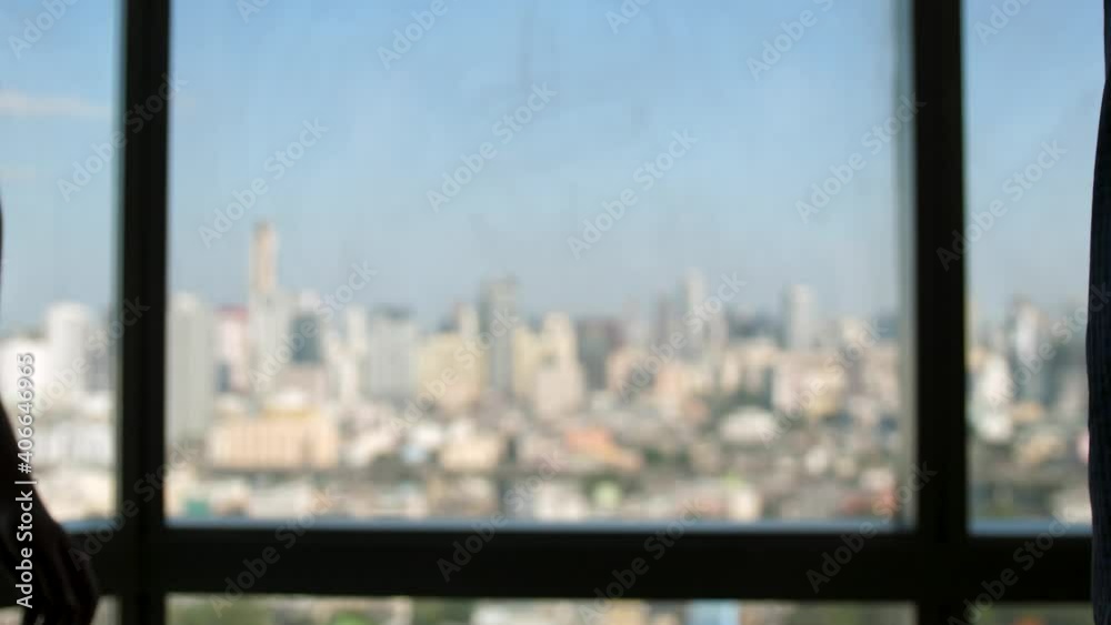 Close up of the hands of top managers in business suits, shake hands with each other, against the window in the office, agree to a deal or say hello. slow motion Close up of the hands of top managers in business suits, shake hands with each other, against the window in the office, agree to a deal or say hello. slow motion