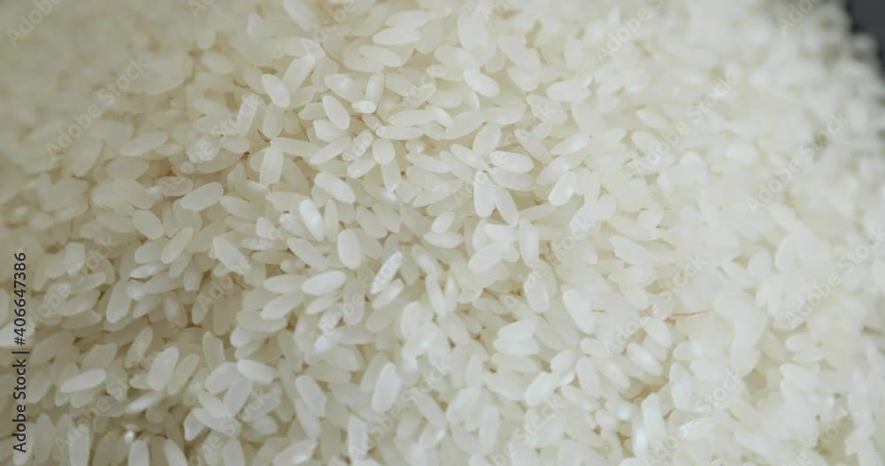 Pile Of White Raw Rice Grains Rotating