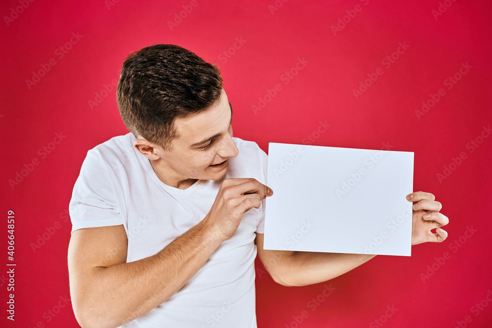 man holding white sheet copy space office close-up red background