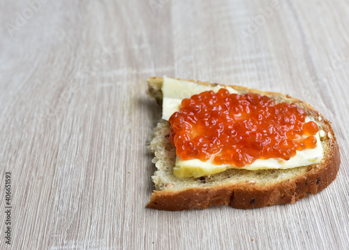 Red caviar on a loaf with butter.