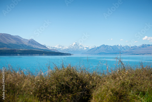 Mount Cook landscape on clear sky day view from Lake Pukaki, the highest mountain in New Zealand and popular travel destination.