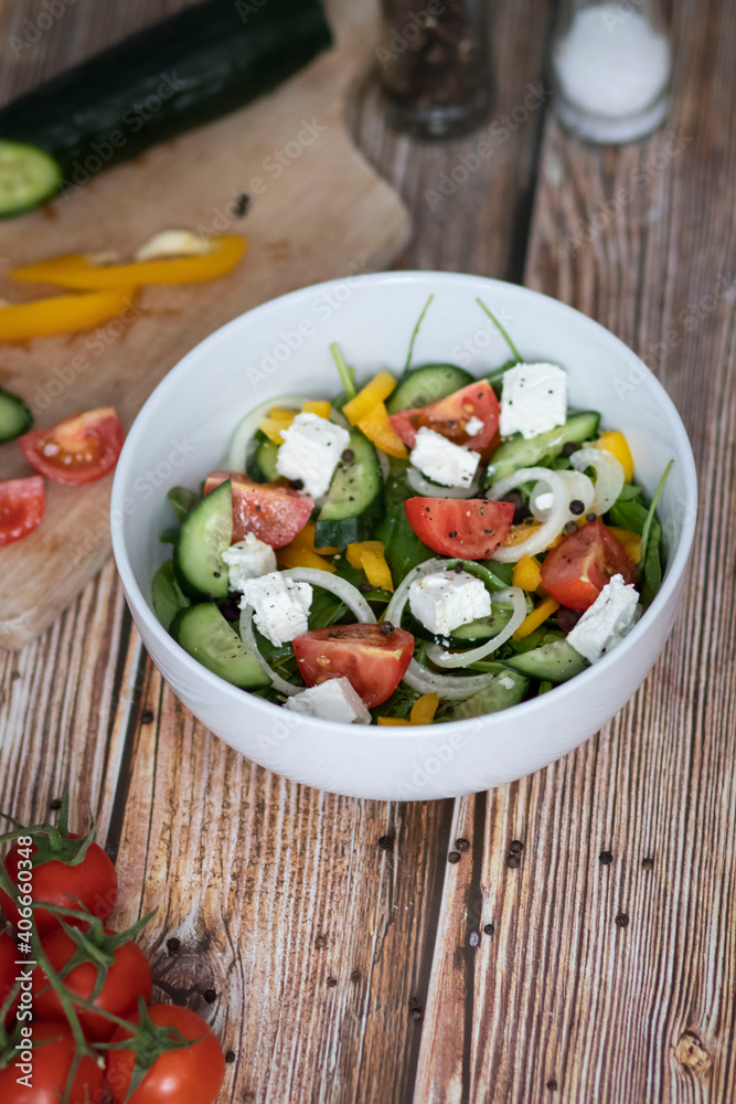 Green vegan salad made from a mixture of green leaves and vegetables. Green vegan salad made from a mixture of green leaves and vegetables.