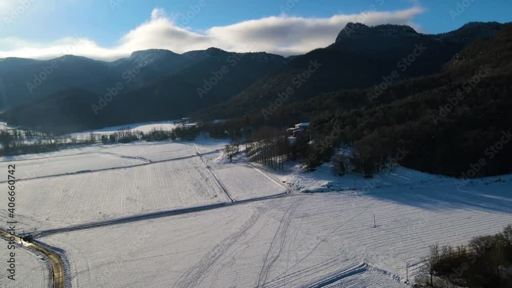 Aerial scene with drone of the snowfall in Hostalets d En Bas, La Garrotxa, Girona, Spain