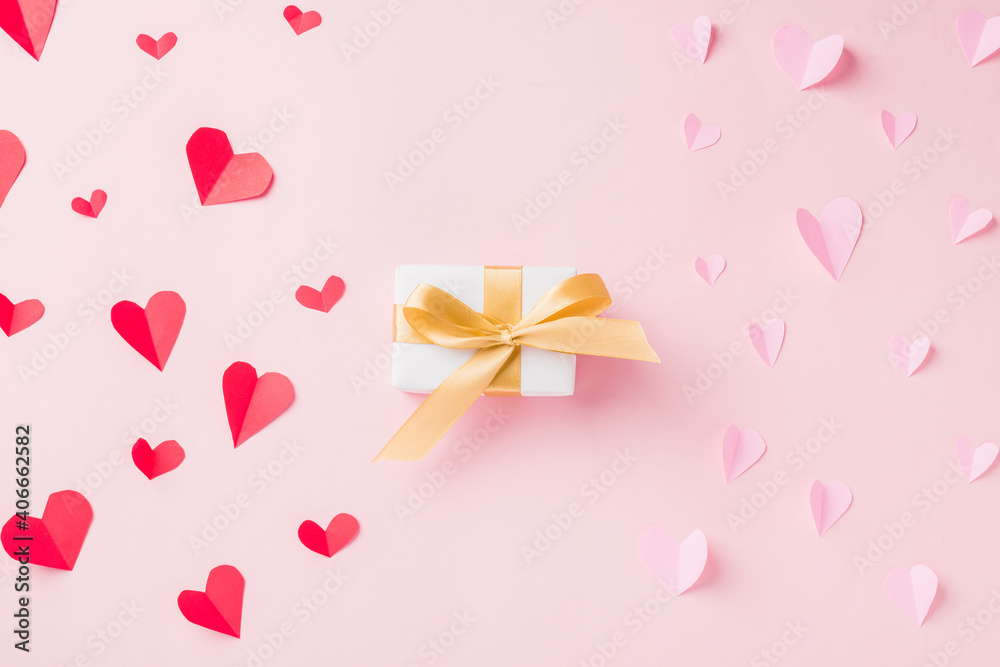 Valentines' day background. White gift box postcard and paper flying elements hearts cut greeting gift card on pink background, Symbol of love. Happy Mother's, Valentine's Day concept