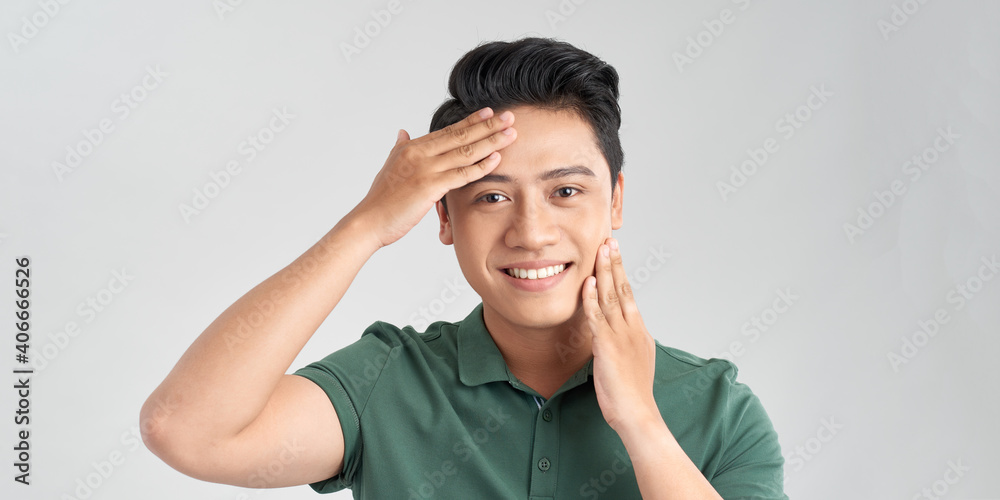 Portrait of Handsome young asian man on white background. Concept of men's health and beauty, self-care, body and skin care Portrait of Handsome young asian man on white background. Concept of men's health and beauty, self-care, body and skin care