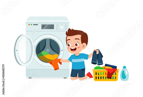 happy cute kid do laundry with washing machine