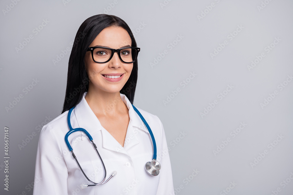 Photo of doctor lady toothy shiny smile look camera wear stethoscope specs white uniform isolated grey color background Photo of doctor lady toothy shiny smile look camera wear stethoscope specs white uniform isolated grey color background