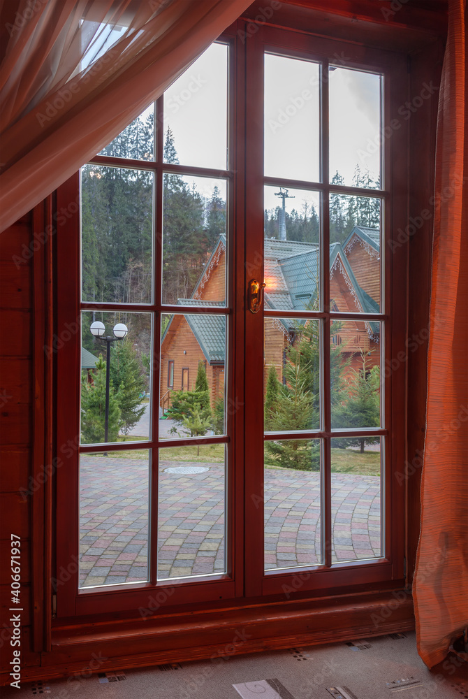 Large floor to ceiling wooden window, inside view Large floor to ceiling wooden window, inside view