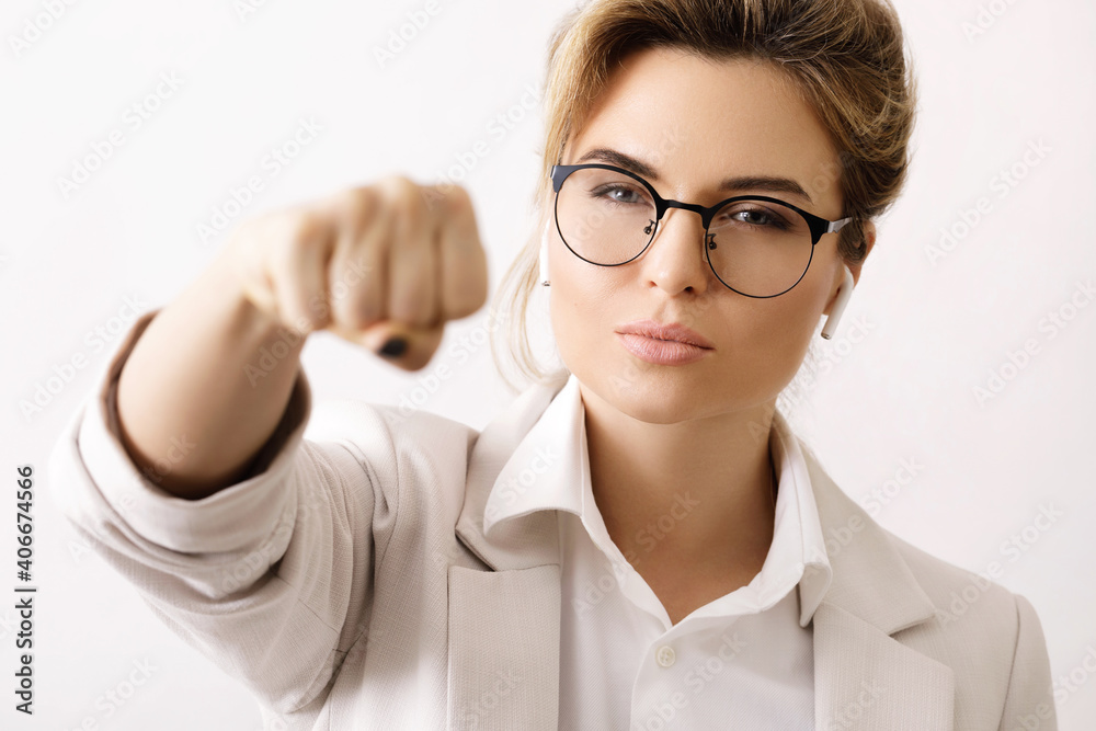 Confident business woman make a punch into the camera Confident business woman make a punch into the camera