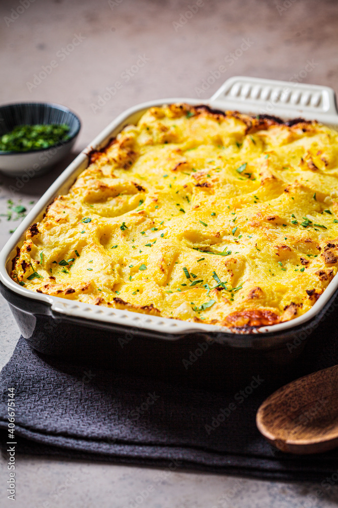 Traditional shepherd's pie with meat and mashed potatoes in black backing dish. Comfort food concept. Traditional shepherd's pie with meat and mashed potatoes in black backing dish. Comfort food concept.