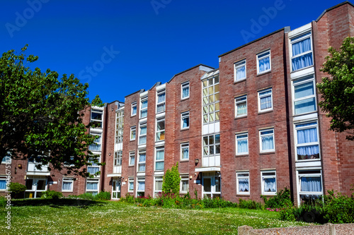 Modern new council housing estate of terraced houses and apartment flats in England UK, stock photo image