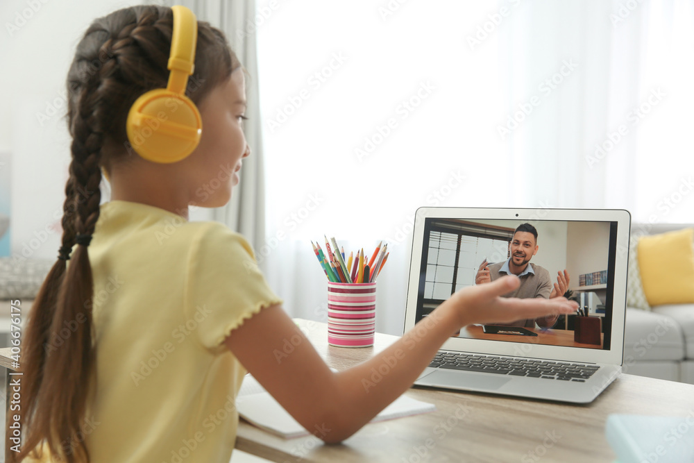 Distance learning, studying at home. Girl having online school lesson ...