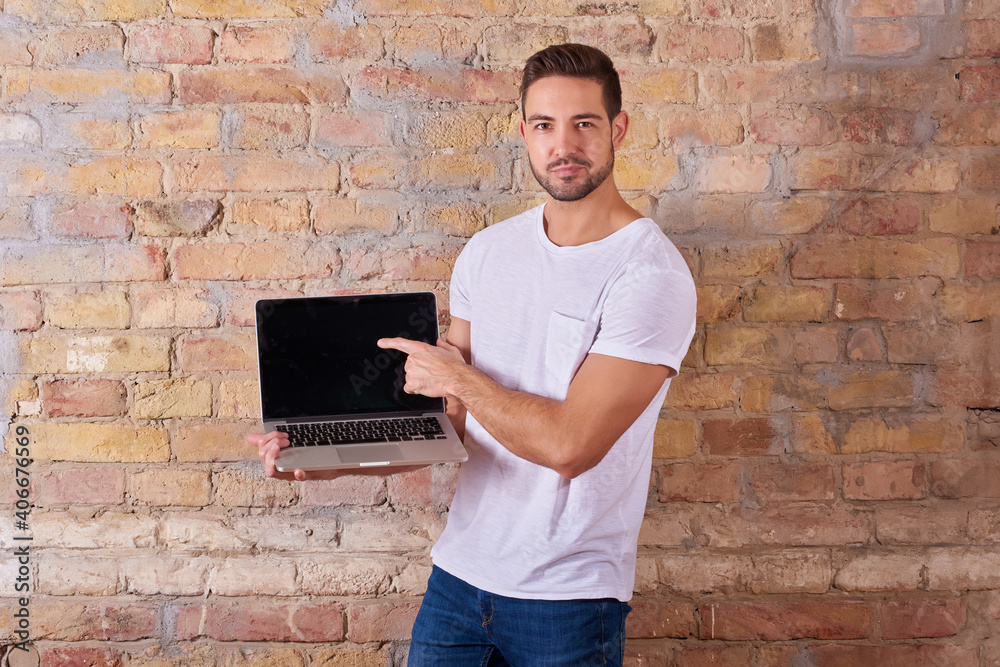 Serious man pointing to screen Serious man pointing to screen