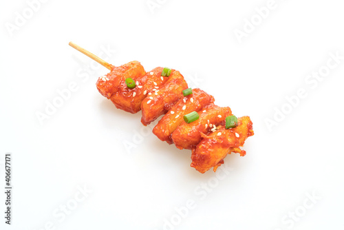 deep fried Korean rice cake (Tteokbokki) skewered with spicy sauce photo