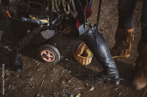 Fototapeta Naklejka Na Ścianę i Meble -  Black riding boots with other riding equipment