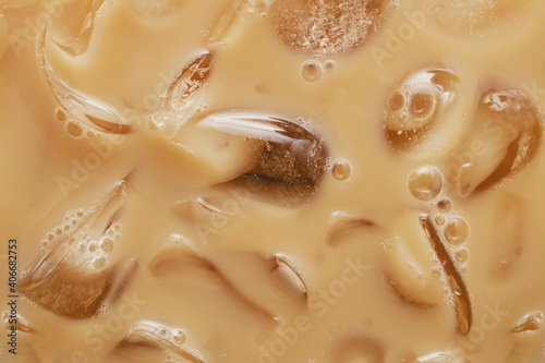 Papier peint Close-up of Cold latte drink with ice cubes,