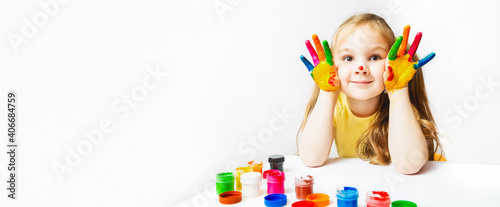 children s creativity. Portrait Cute caucasian preschool little girl with face and hands painted at home