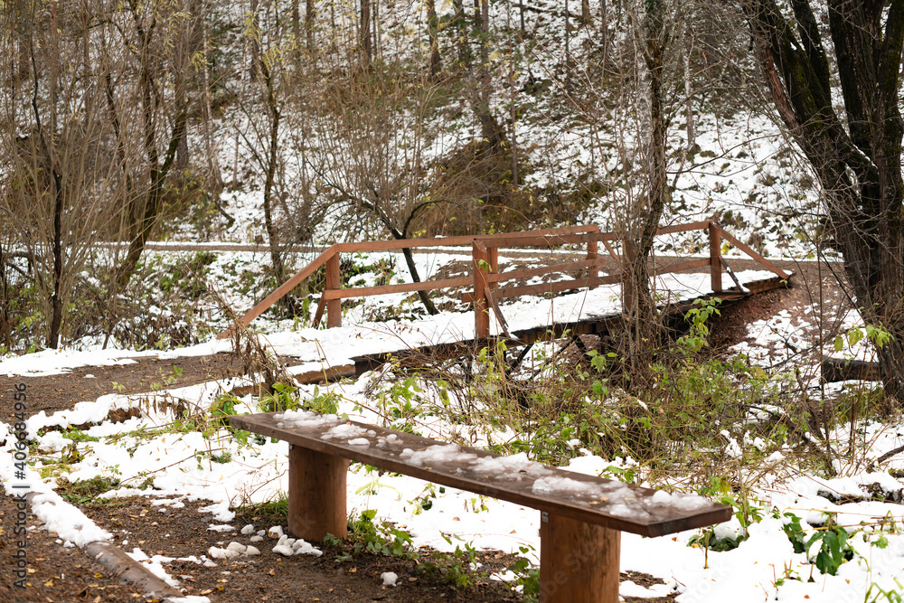 A stream near the path in the winter national park. A stream near the path in the winter national park.