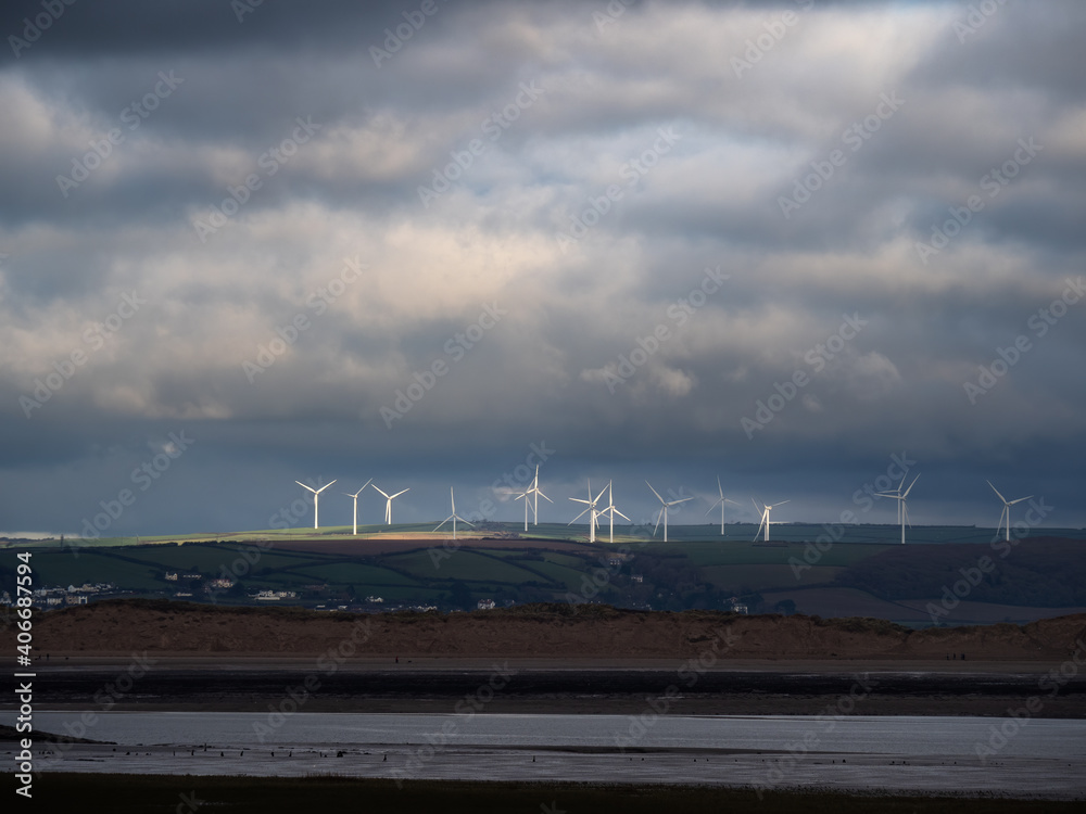 Fototapeta premium View from Northam Burrows to Fullabrook wind farm, North Devon, England on a stormy day.