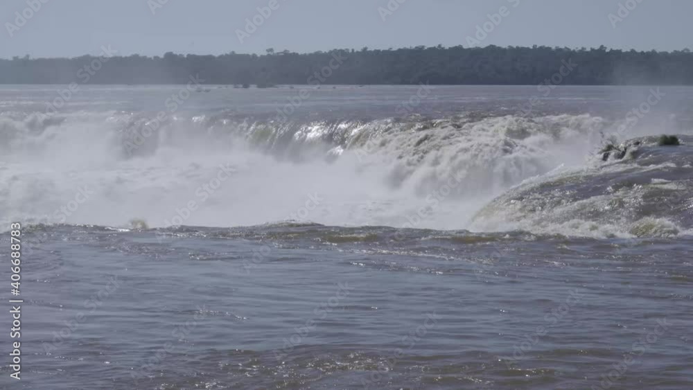 Iguazu Fa Iguazu Falls are waterfalls of the Iguazu River on the border between Argentina and Brazil. They are the largest waterfall system in the world. Iguazu Fa Iguazu Falls are waterfalls of the Iguazu River on the border between Argentina and Brazil. They are the largest waterfall system in the world.