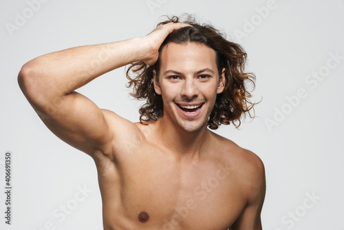 Excited shirtless guy posing and looking at camera