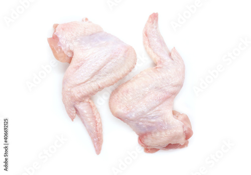 Raw Chicken wings isolated on white background. Two fresh chicken wings for cooking. Close-up. Top view.