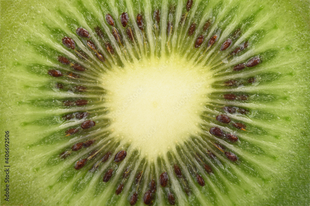 A slice of ripe juicy kiwi very close-up for the whole frame. A slice of ripe juicy kiwi very close-up for the whole frame.