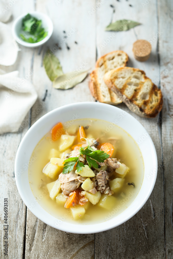 Traditional homemade fish soup with vegetables Traditional homemade fish soup with vegetables