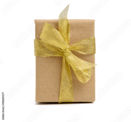 box wrapped in brown kraft paper and tied with golen ribbon photo