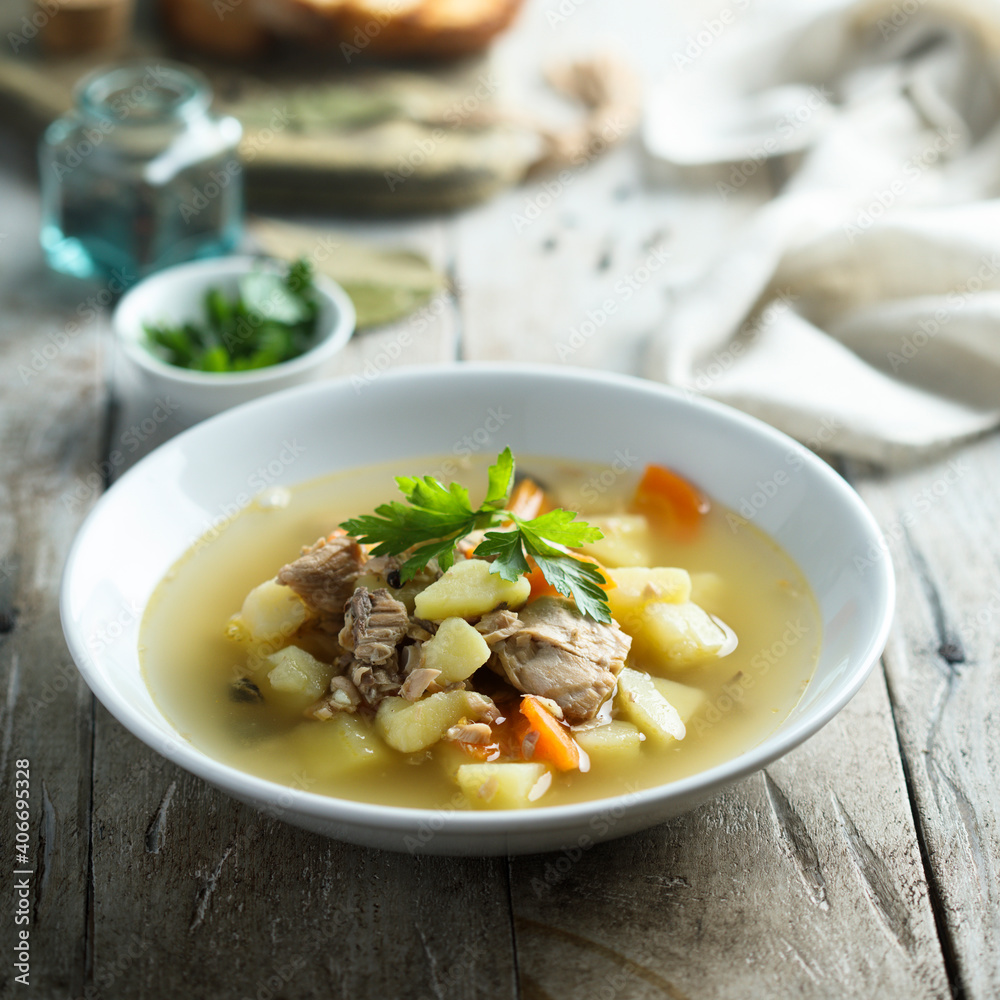 Traditional homemade fish soup with vegetables Traditional homemade fish soup with vegetables