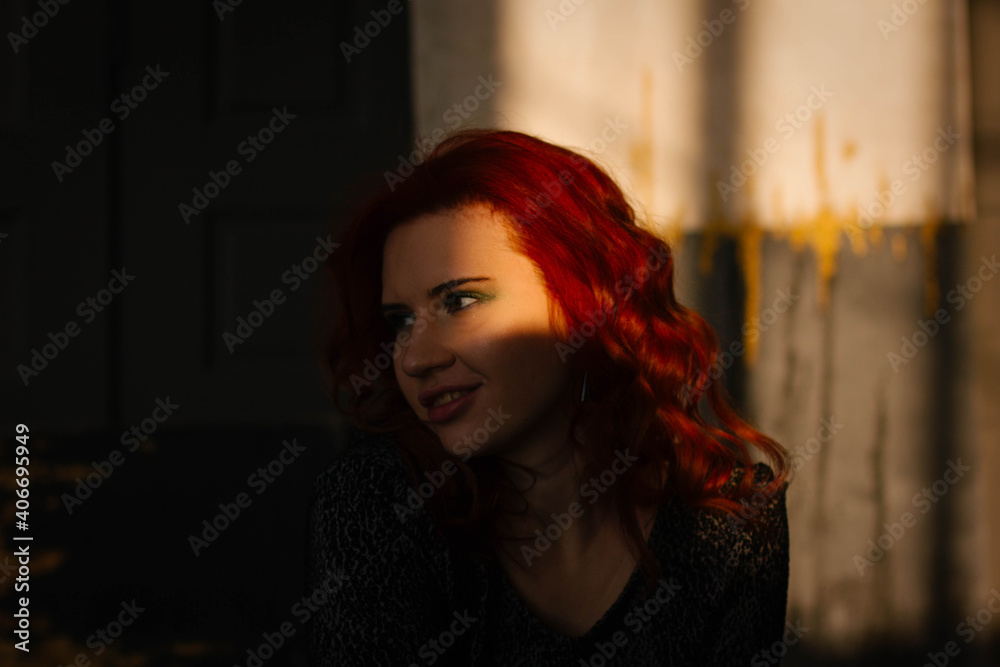 portrait of a red-haired girl in the studio of a young woman