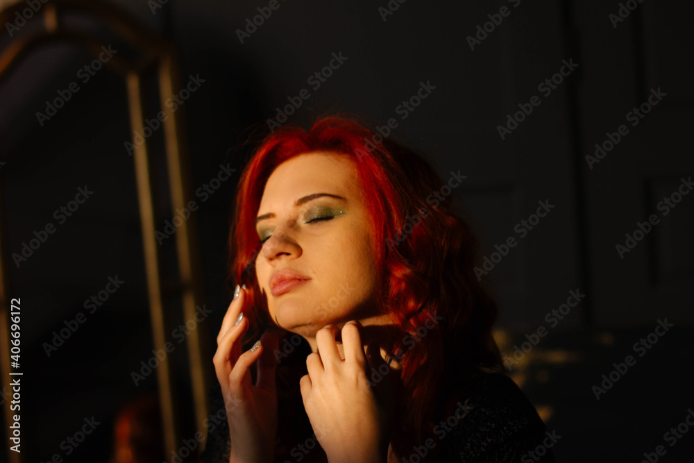 portrait of a red-haired girl in the studio of a young woman portrait of a red-haired girl in the studio of a young woman