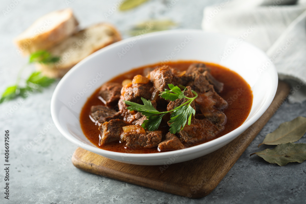 Traditional homemade beef goulash with fresh parsley Traditional homemade beef goulash with fresh parsley