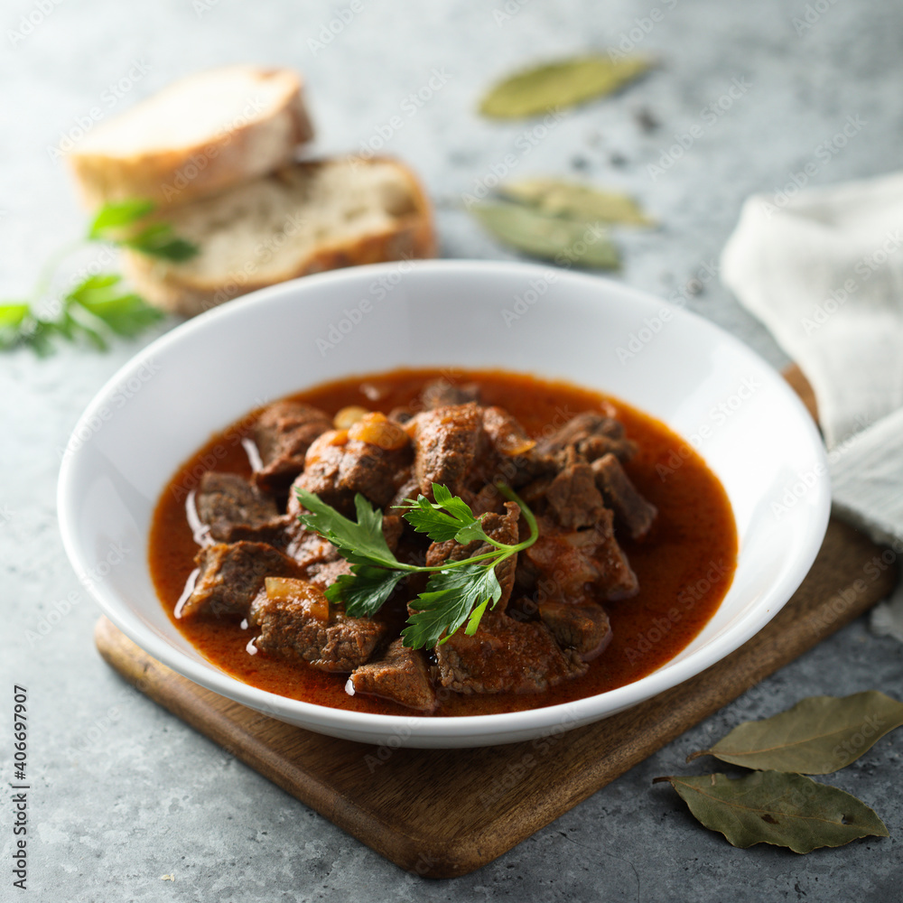 Traditional homemade beef goulash with fresh parsley Traditional homemade beef goulash with fresh parsley