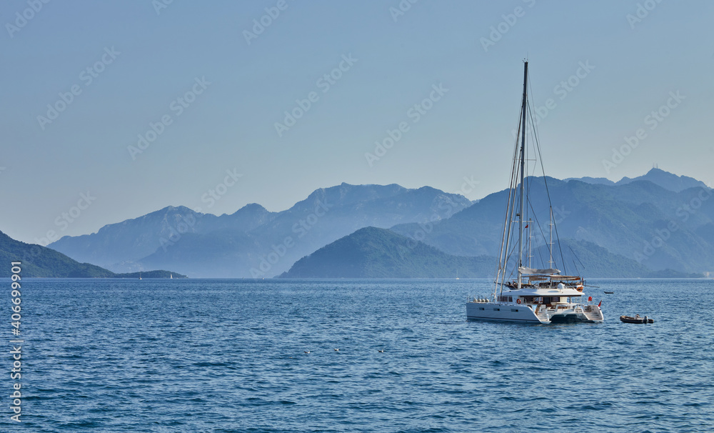 White yachts in the beautiful blue sea, travel, recreation and vacation concept.