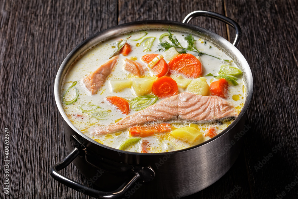 salmon fish soup with cream and veggies, top view salmon fish soup with cream and veggies, top view