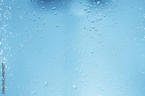 wet glass background condensate / abstract rain, drops texture on transparent glass © kichigin19