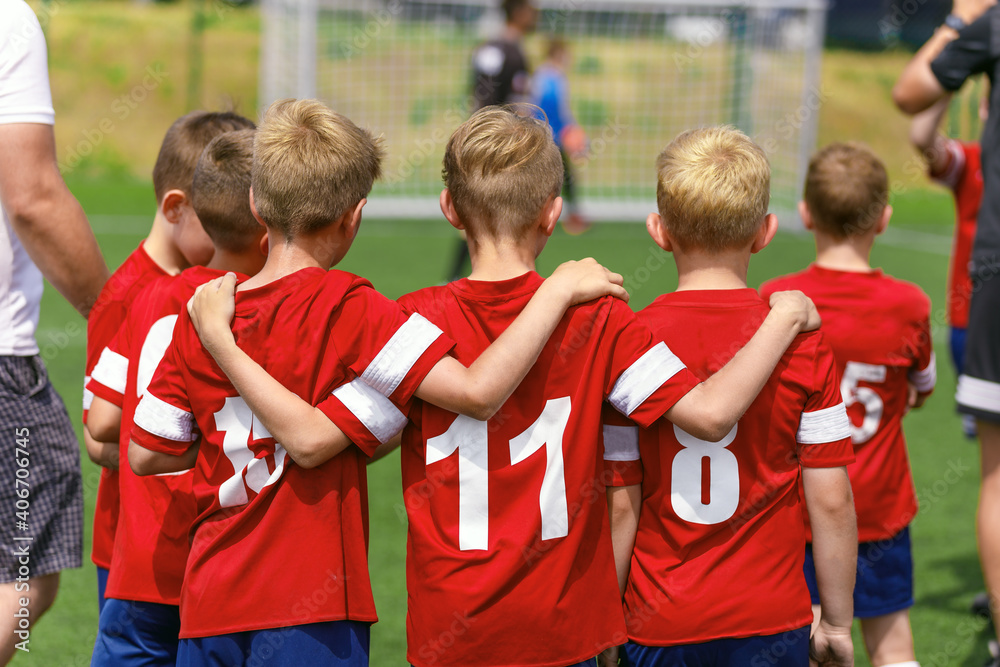 Youth Soccer Team Substitute Players. Boys Standing in a Row Huddling During Penalty Kicks. Football Tournament Competition for Kids Youth Soccer Team Substitute Players. Boys Standing in a Row Huddling During Penalty Kicks. Football Tournament Competition for Kids