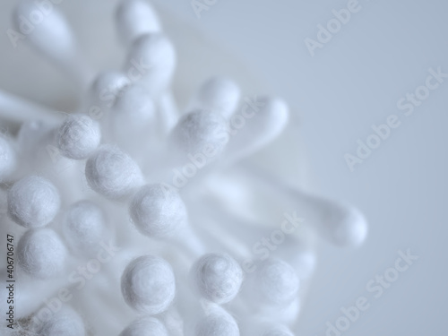Cotton buds top view, (Macro shot focus on cotton) on blurred gray background with copy space.
