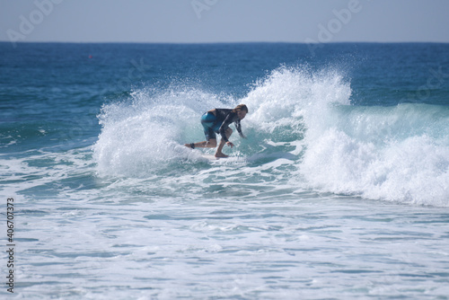 Surfer making a spray of water on the wave.